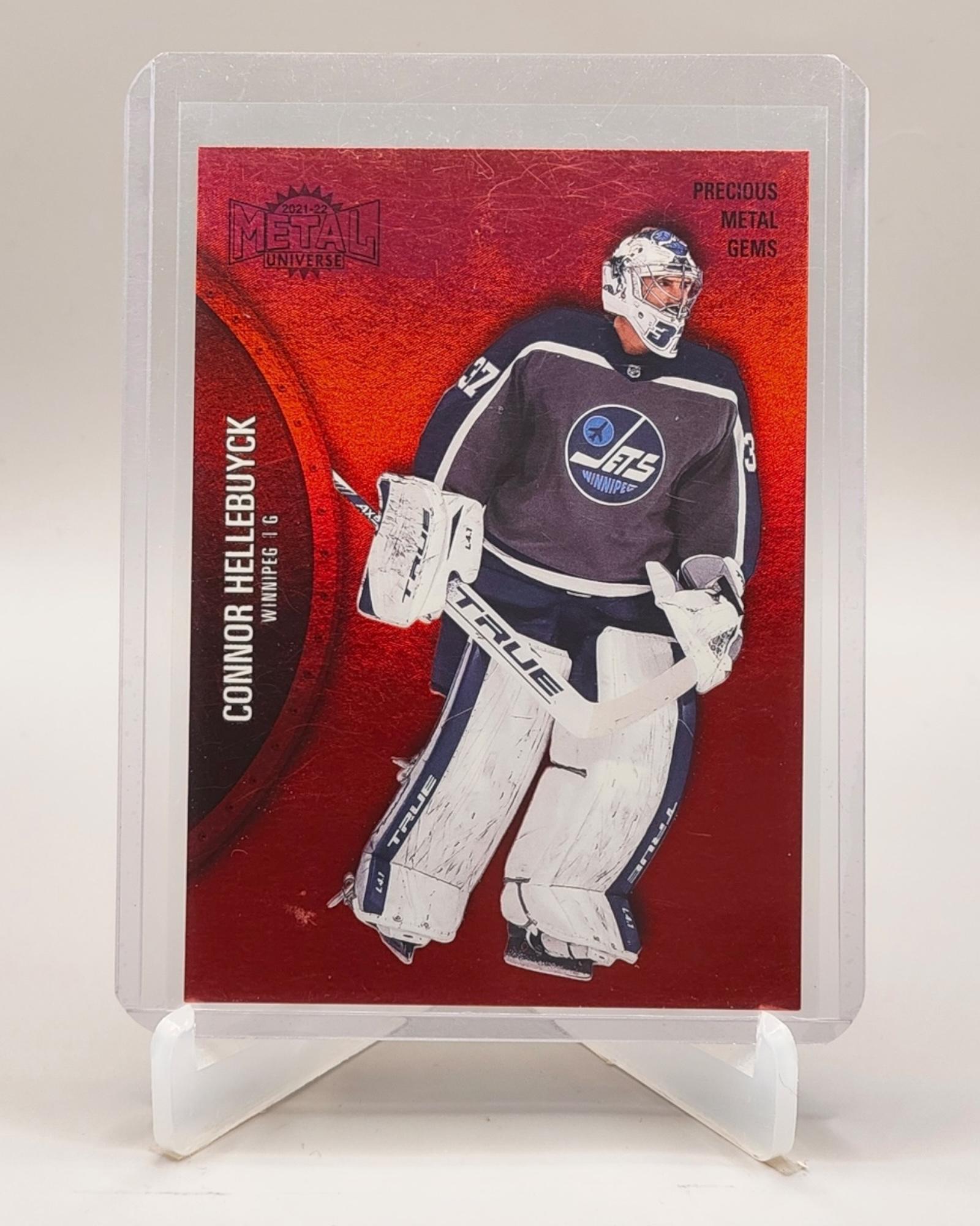 2021-22 SkyBox Metal Universe #104 Connor Hellebuyck PMG Red #/100